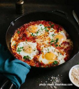 Baked Eggs in Stewed Tomatoes Photo