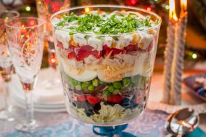 christmas layered salad (salad leaves, black olives, tomatoes, mushrooms, peas, eggs, cheese, chicken, capsicum, corn)
